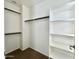 Walk-in closet featuring built-in shelving and clothing rods at 2344 W Barwick Dr, Phoenix, AZ 85085