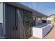 Backyard featuring an outdoor shower with blue skies above the trees at 2507 E Golden St, Mesa, AZ 85213