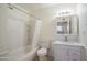 Bathroom featuring a vanity with a mirror, a toilet, and a bathtub with shower at 2507 E Golden St, Mesa, AZ 85213