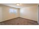 Bedroom featuring neutral walls, carpet, a window, and electrical outlets at 2507 E Golden St, Mesa, AZ 85213