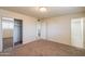 Spacious bedroom with neutral walls, carpet and access to the bathroom and walk-in closet at 2507 E Golden St, Mesa, AZ 85213