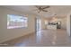 Open-concept living area with tile floors, a bright window, and a seamless flow to the kitchen at 2507 E Golden St, Mesa, AZ 85213