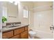 Clean bathroom featuring a shower-tub combination, updated vanity, and neutral tile flooring at 2722 E Wesson Dr, Chandler, AZ 85286