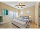 Cozy bedroom with neutral walls, and a ceiling fan creating a calming atmosphere for relaxation at 2722 E Wesson Dr, Chandler, AZ 85286