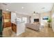 Open-concept living room with a modern kitchen, tile floors, and natural light creating a welcoming atmosphere at 2722 E Wesson Dr, Chandler, AZ 85286