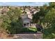 An aerial view of a beautiful home featuring a manicured lawn, mature trees, and a backyard at 2726 S Keene --, Mesa, AZ 85209