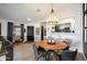 Cozy dining area with a wooden table, modern chairs, and stylish lighting, creating a perfect space for gatherings at 2726 S Keene --, Mesa, AZ 85209