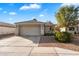 Charming home with a tile roof, a two-car garage, landscaping, and a cozy, inviting curb appeal at 2726 S Keene --, Mesa, AZ 85209