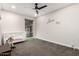 Bright bedroom showcasing carpet floors, a ceiling fan, and a window allowing natural light at 2920 S Bala Dr, Tempe, AZ 85282