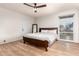 Bright bedroom with wood floors, and a large window offering natural light at 2920 S Bala Dr, Tempe, AZ 85282