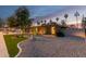 Stylish single-story home showcasing modern landscaping, a stone driveway, a brick facade, and desert plants at 2920 S Bala Dr, Tempe, AZ 85282