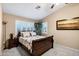 Comfortable bedroom with a decorative bedspread, shutters, and warm color palette at 3017 S Mesita --, Mesa, AZ 85212