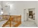 Upstairs hallway features wood railing and neutral carpet with bedroom and bathroom entrance in view at 3017 S Mesita --, Mesa, AZ 85212