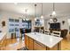 Open kitchen featuring a large island with quartz counters, wooden cabinets and stainless steel dishwasher at 3017 S Mesita --, Mesa, AZ 85212