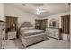 Spacious main bedroom features decorative headboard, neutral walls, ceiling fan and matching furniture at 3017 S Mesita --, Mesa, AZ 85212