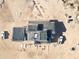 Overhead view of an expansive home under construction, showing the roof partially done at 30498 N 232Nd Ave, Wittmann, AZ 85361