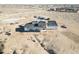 Aerial view of home under construction in a desert landscape, showing framing and roofing progress at 30498 N 232Nd Ave, Wittmann, AZ 85361