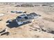 Aerial view of an expansive home under construction, with the roof partially done at 30498 N 232Nd Ave, Wittmann, AZ 85361