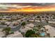 Aerial view of a neighborhood at sunset showing the community layout, streets, and surrounding landscape at 3482 W Shannon St, Chandler, AZ 85226