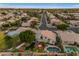 Elevated aerial perspective highlights the manicured landscaping and backyard pool of a home in a planned community at 3482 W Shannon St, Chandler, AZ 85226