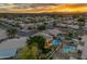 An aerial view highlights a stunning neighborhood, showcasing mature landscaping and a private backyard pool oasis at 3482 W Shannon St, Chandler, AZ 85226