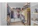 Walk-in closet with ample clothing and shoe storage space, shelves, and clothing racks at 3482 W Shannon St, Chandler, AZ 85226