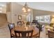 Bright dining area boasts high ceilings and a large, elegant chandelier at 3482 W Shannon St, Chandler, AZ 85226