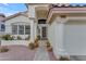 Inviting front entry with decorative columns, manicured plants, and charming accents at 3482 W Shannon St, Chandler, AZ 85226