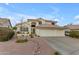 Charming two-story home featuring a three-car garage, and a meticulously xeriscaped front yard at 3482 W Shannon St, Chandler, AZ 85226