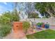 Relaxing hot tub area with a tiled patio and lush landscaping providing privacy and tranquility at 3482 W Shannon St, Chandler, AZ 85226