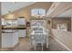 Eat-in kitchen area features white cabinets and views of the backyard at 3482 W Shannon St, Chandler, AZ 85226