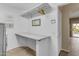 Laundry room with shelving and folding area, with the washer dryer out of shot at 3482 W Shannon St, Chandler, AZ 85226