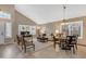 Bright living room features vaulted ceiling, neutral tones, and large windows with plantation shutters at 3482 W Shannon St, Chandler, AZ 85226