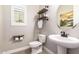 Half bathroom with unique shelving and a modern vessel sink at 3623 E Arabian Dr, Gilbert, AZ 85296