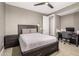 Bedroom featuring a modern ceiling fan, a wooden bed frame and a desk at 3623 E Arabian Dr, Gilbert, AZ 85296