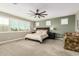 Bedroom with neutral colors, large windows, and a patterned chaise lounge chair at 3623 E Arabian Dr, Gilbert, AZ 85296