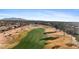 Scenic aerial perspective showcases the golf course and surrounding homes at 3711 N 162Nd Ln, Goodyear, AZ 85395