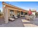 Relaxing outdoor patio with comfortable seating and dining area at 3711 N 162Nd Ln, Goodyear, AZ 85395