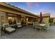 Spacious covered patio with outdoor seating and pavers, perfect for entertaining at 3711 N 162Nd Ln, Goodyear, AZ 85395