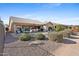 Large backyard with a patio, seating, desert landscaping, and BBQ at 3711 N 162Nd Ln, Goodyear, AZ 85395