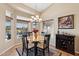 Dining room with a table and seating for four near lots of natural light at 3711 N 162Nd Ln, Goodyear, AZ 85395