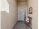 Inviting entryway featuring a cozy bench, decorative pillow, and stylish wall decor at 3711 N 162Nd Ln, Goodyear, AZ 85395