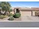 Beautiful single-story home featuring a well-manicured yard and a spacious two-car garage at 3711 N 162Nd Ln, Goodyear, AZ 85395