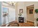 Welcoming foyer with an elegant chandelier, neutral walls, and stylish decor at 3711 N 162Nd Ln, Goodyear, AZ 85395