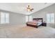 Spacious bedroom featuring a vaulted ceiling, large windows with shutters, and neutral color palette at 38572 N Jessica Ln, San Tan Valley, AZ 85140