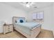 Bright bedroom featuring a cozy bed with shuttered windows and a ceiling fan at 38572 N Jessica Ln, San Tan Valley, AZ 85140