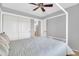 Light and airy bedroom with a ceiling fan, neutral tones, closet, and ample space for relaxation at 38572 N Jessica Ln, San Tan Valley, AZ 85140