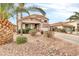 Charming two-story home with a well-manicured front yard, desert landscaping, and a welcoming entrance at 38572 N Jessica Ln, San Tan Valley, AZ 85140