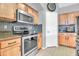 Close up of a kitchen with stainless steel appliances and wooden cabinetry at 38572 N Jessica Ln, San Tan Valley, AZ 85140