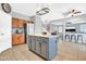 Spacious kitchen featuring a large island with seating and stainless steel refrigerator at 38572 N Jessica Ln, San Tan Valley, AZ 85140